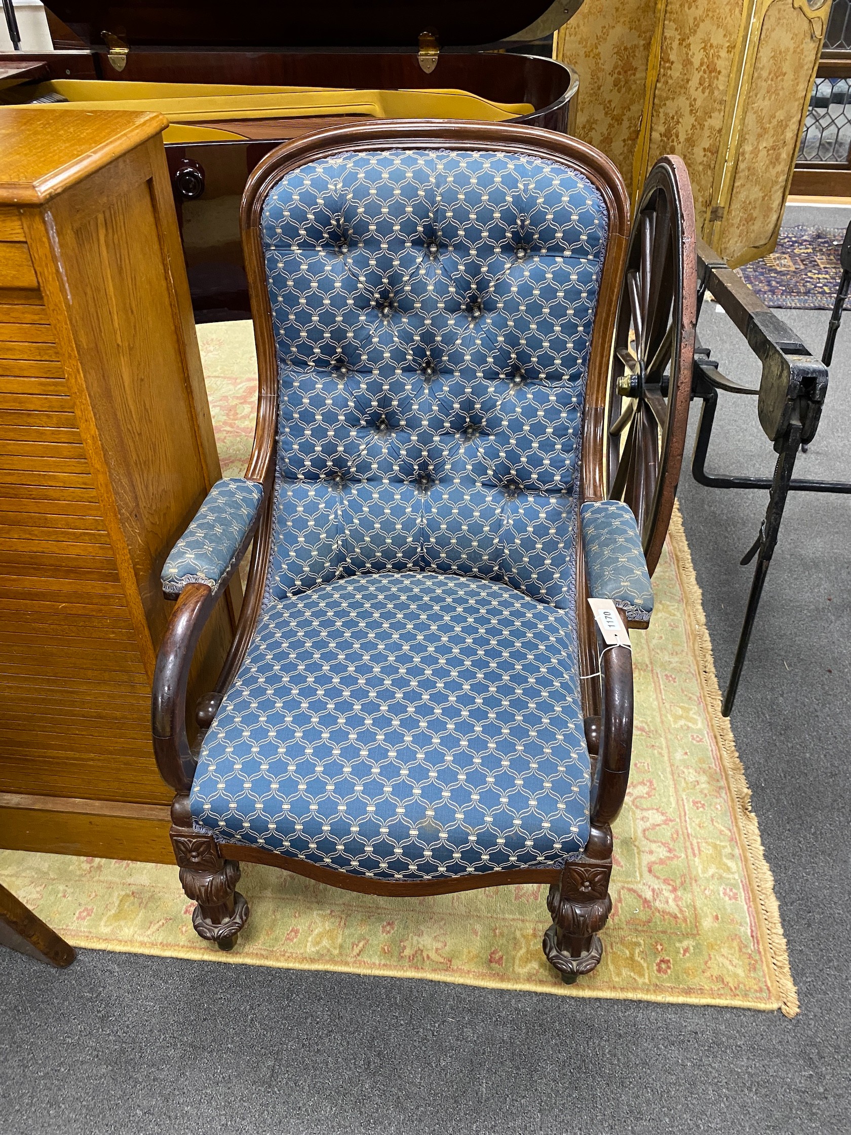 A mid Victorian rosewood upholstered buttonback open armchair, width 65cm, depth 70cm, height 105cm